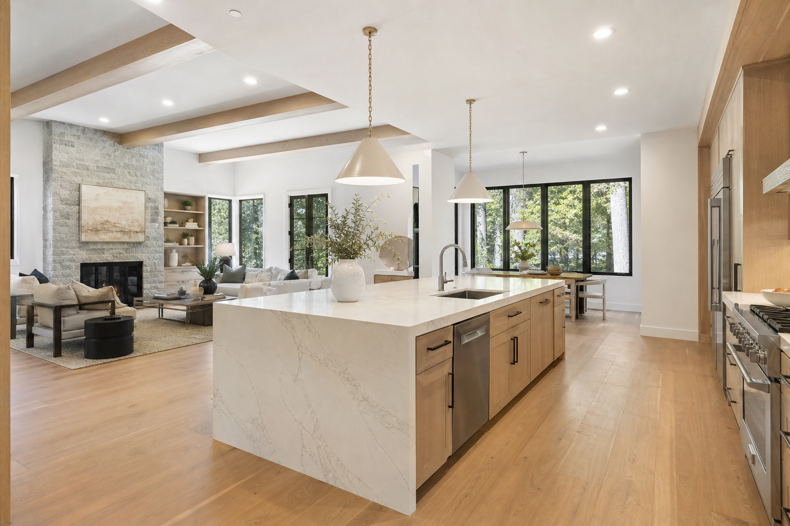 Bright open-concept kitchen with white oak cabinetry and waterfall quartz island, representative rendering